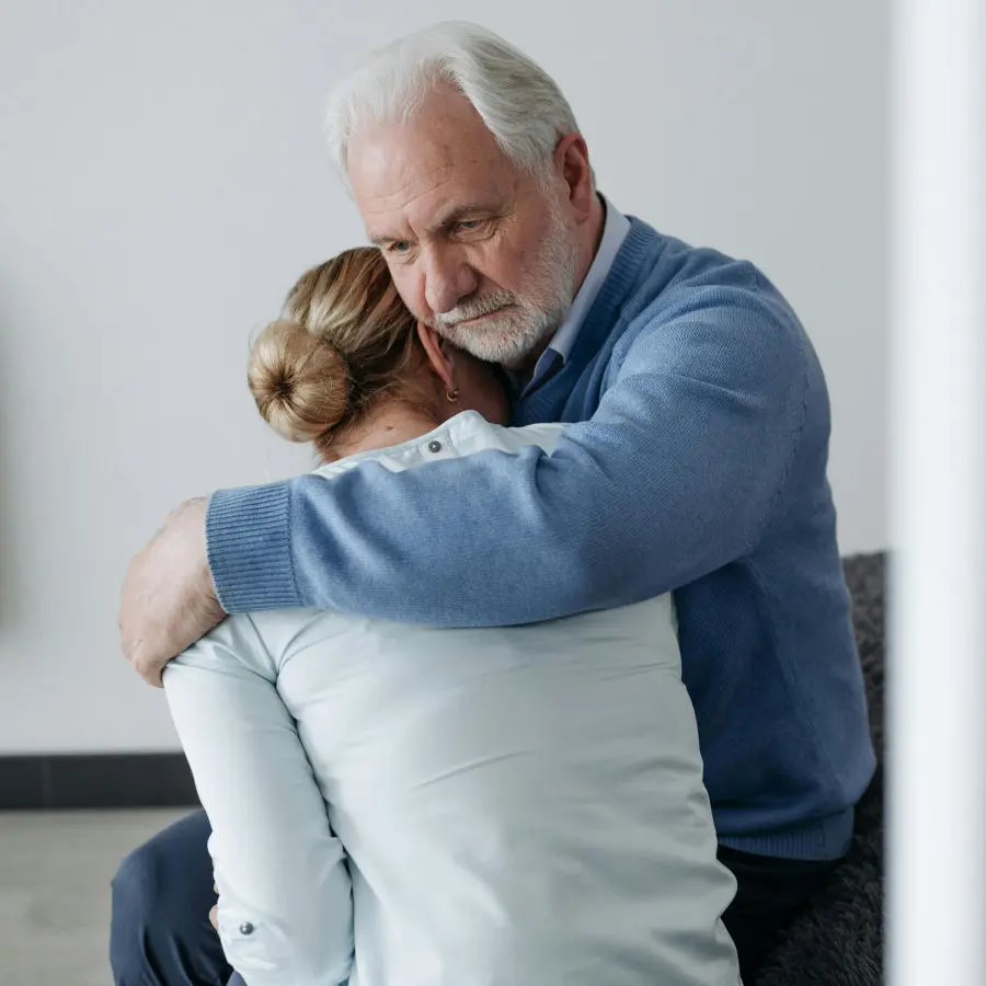 Old couple embracing