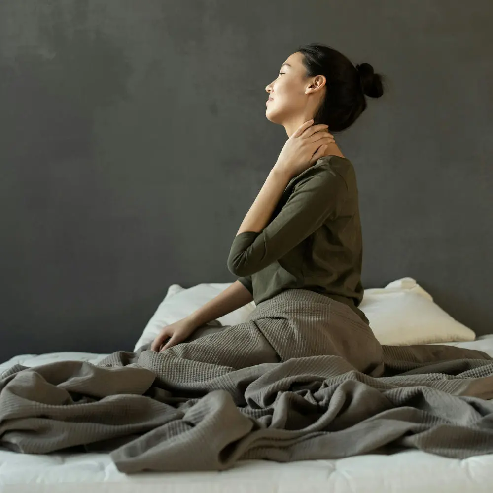 Woman holding her neck